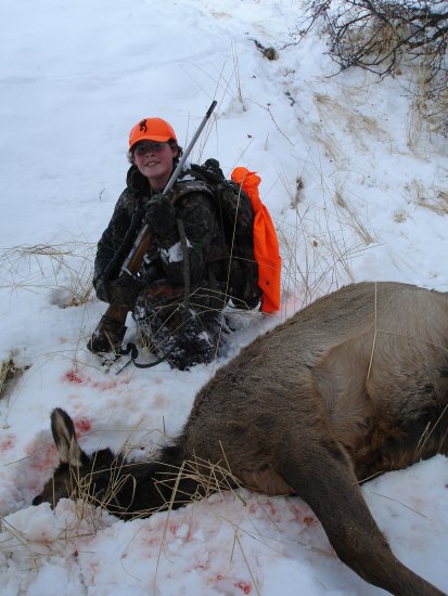 Dallen with 243 WSSM rifle and his first cow elk