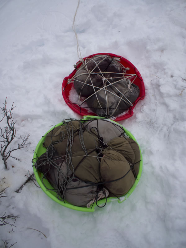 Meat Saucer Sleds filled with bone out cow elk ready to be hauled off the mountain.