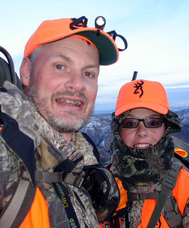 Dallen and I just before dark hauling his first mule deer off the mountain.