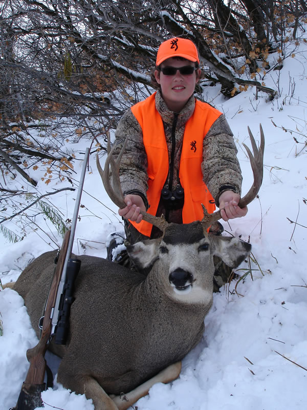 Dallen and his first mule deer buck taken with a 243 WSSM A-Bolt rifle