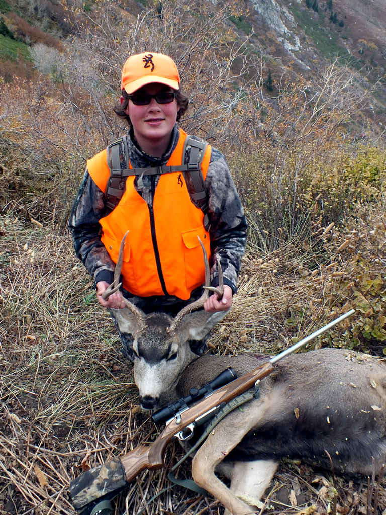Dallen with his 2011 mule deer buck taken with a 243 WSSM at 619 yards