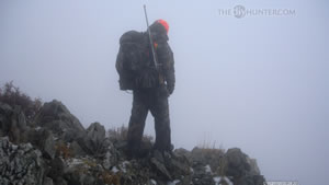 Dallen Looking Over Cliff Mule Deer Hunting in 2009 Wallpaper