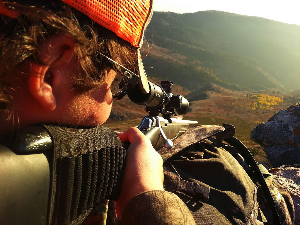 X-Bolt Rifle and Vortex Viper HSLR scope shooting from rocks.