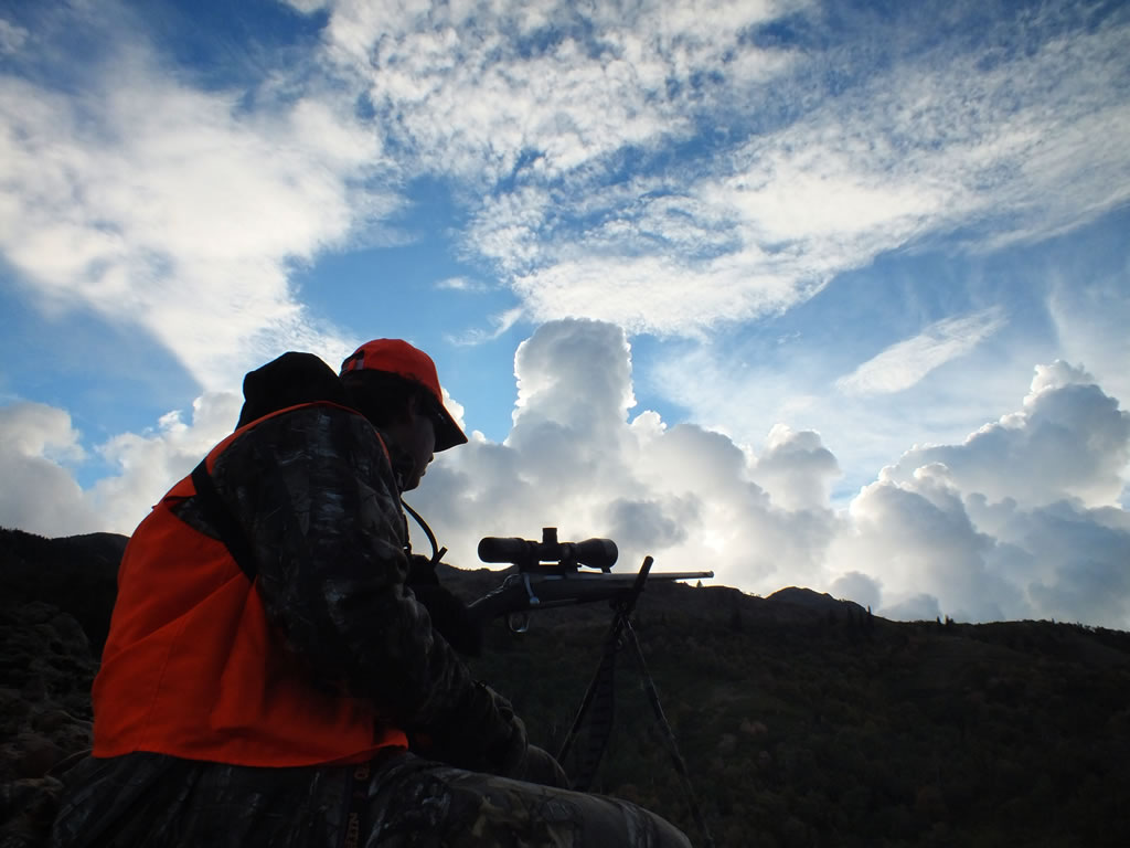 Hunting with clouds in background.