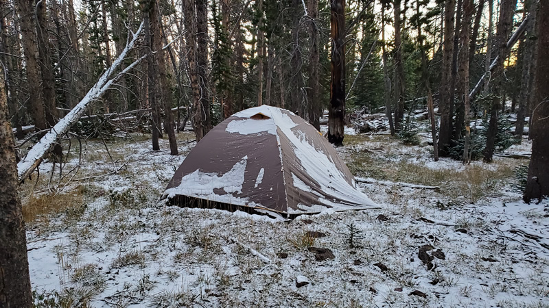 Waking up to snow whil archery elk hunting in Uinta mountains.