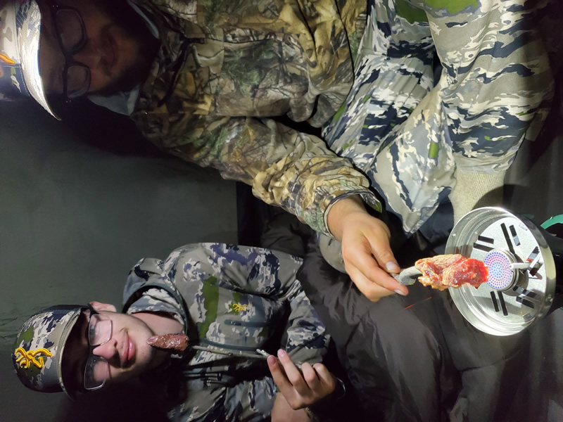 Cooking backstrap in the tent while hunting.